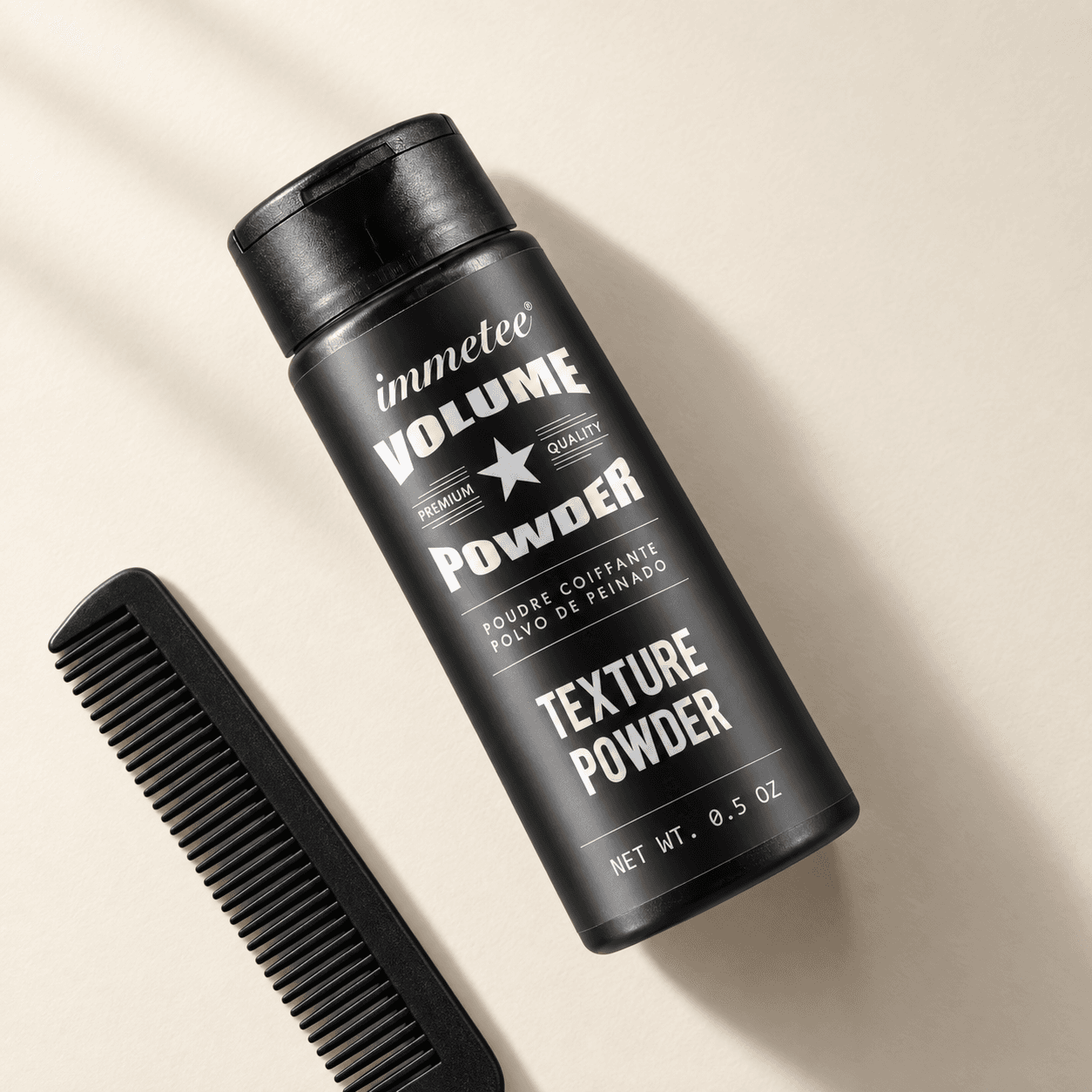 immetee texture powder beside a black styling comb